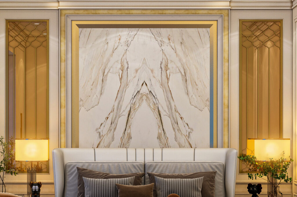 Book matched marble feature wall framed in brass with onyx side niches