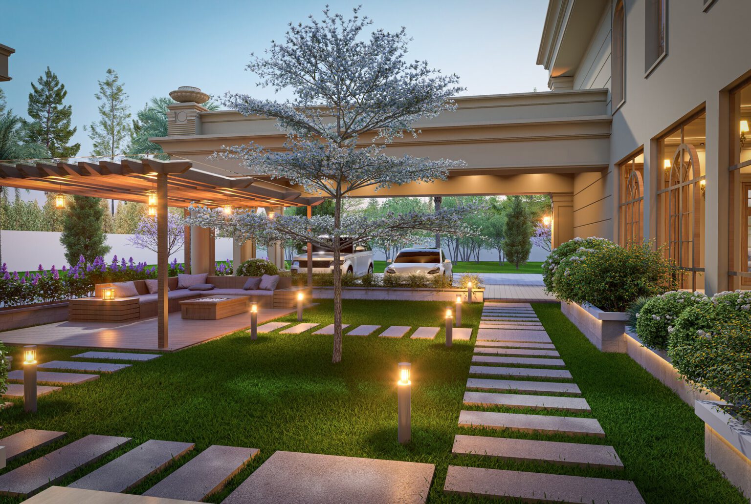 Covered entrance drive with a sculptural tree and warm uplighting